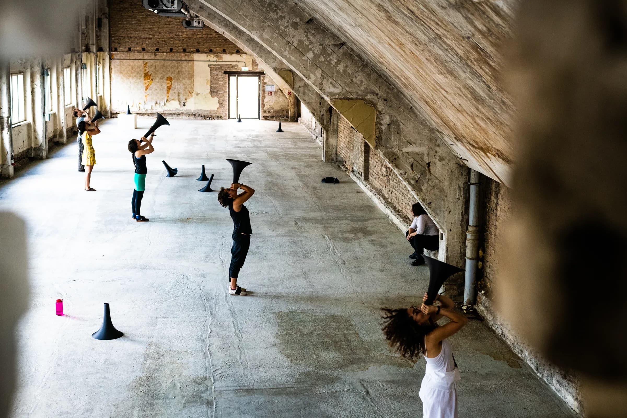 Performer with megaphone in a Funkhaus studio